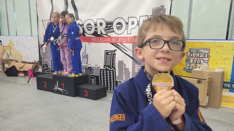 Sebastien Black, 9, holds up a medal he received for participating in the inaugural Windsor Open Brazilian Jiu-Jitsu Tournament on May 25, 2024. (Sanjay Maru/CTV News Windsor)