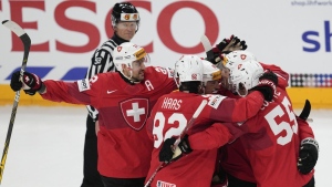 Switzerland's Kevin Fiala celebrates with teammates after scoring against Canada at the 2024 World Championships. (Darko Vojinovic/AP Photo)