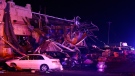 Several cars are seen heavily damaged outside the remains of a Shell gas station after a suspected tornado, Sunday, May 26, 2024, in Valley View, Texas.  (Elías Valverde II/The Dallas Morning News via AP)
