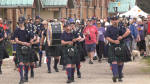 Bagpipers leading a large crowd of hikers at the Hike and Bike in Collingwood, Ont on May 26, 2024 (CTV News/Mike Lang).