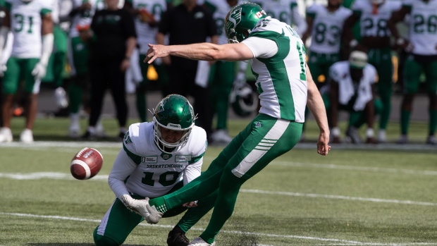 Saskatchewan Roughriders' Brett Lauther (12) kicks the field goal to win the game against the Edmonton Elks during second half CFL preseason action in Edmonton, Alta., on Saturday May 25, 2024. THE CANADIAN PRESS/Jason Franson.