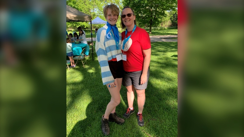 12-year-old Kaylee Chappell and her mother Alysia Chappell take part in London's Walk to Make Cystic Fibrosis History at Greenway Park on May 26, 2024. Kaylee sports the blue and white scarf to let people know she is a child participant in the walk who lives with cystic fibrosis. (Bryan Bicknell/CTV News London)