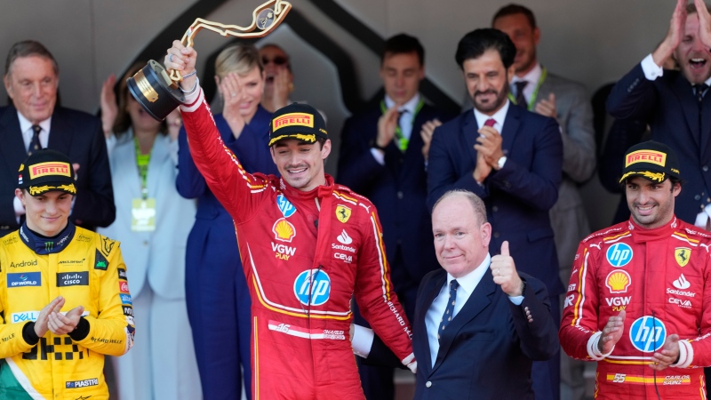 Ferrari driver Charles Leclerc of Monaco celebrates on the podium after winning the Formula One Monaco Grand Prix race at the Monaco racetrack, in Monaco, Sunday, May 26, 2024. (Luca Bruno / AP Photo)