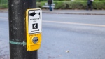 A pedestrian button is seen at an intersection in Vancouver in this undated image. (Shutterstock)