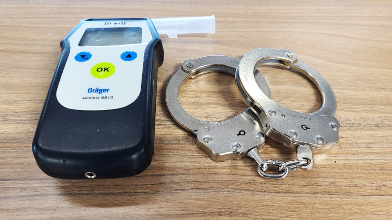 A West Nipissing driver is facing several impaired driving related charges following an incident in the early morning hours of May 23, 2024. Breathalyzer and handcuffs. (File photo/Supplied/Ontario Provincial Police)