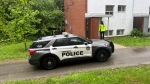 Police are seen on Cataraqui Crescent at the scene of a homicide on May 27, 2024. (Ken Enlow/ CP24)