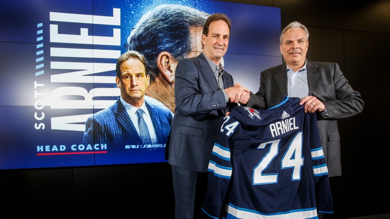 Winnipeg Jets General Manager Kevin Cheveldayoff, right, and head coach Scott Arniel are photographed at a press conference in Winnipeg, Monday, May 27, 2024. The Winnipeg Jets announced the appointment of Arniel as head coach after the retirement of Rick Bowness. THE CANADIAN PRESS/John Woods