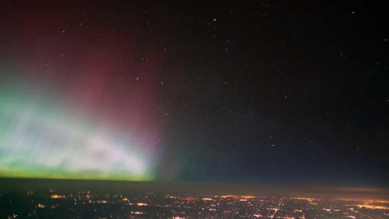 This still from a timelapse video shows northern lights captured by a pilot on May 11, 2024.  (Source: BestAirplaneSeat via Storyful)