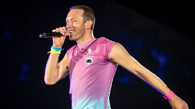 Chris Martin performs in 2023. Martin made news recently by picking up a fan on the way to a music festival. (Mads Claus Rasmussen/Ritzau Scanpix/AFP/Getty Images via CNN Newsource)