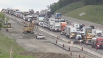 Traffic backups along Highway 400 in Aurora, Ont., following a collision that damaged a guardrail on Tues., May 28, 2024. (CTV News/Steve Mansbridge) 