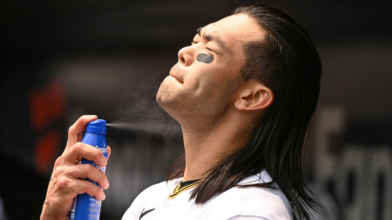 Pittsburgh Pirates right fielder Connor Joe applies sunscreen on May 24, 2024 in Pittsburgh. (Barry Reeger / AP Photo) 