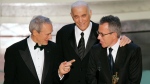 Producers Clint Eastwood, Albert S. Ruddy and Tom Rosenberg, left to right, accept Oscars after the film 'Million Dollar Baby' won for best motion picture of the year at the 77th Academy Awards Sunday, Feb. 27, 2005, in Los Angeles. (Mark J. Terrill / AP Photo)