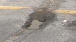 The city has pledged an additional $8.9 million to help in the immediate fight against Calgary's pothole problem.