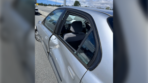 A Honda Civic damaged by a hit-and-run on May 22 is seen in this photo handed out by the North Vancouver RCMP. 
