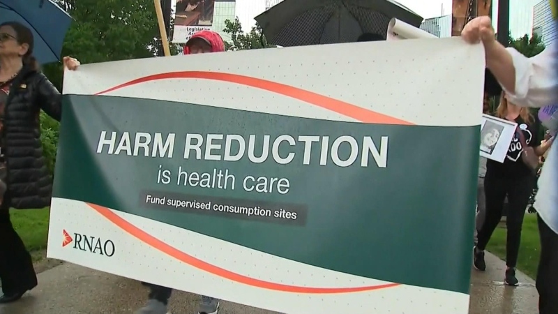 Safe consumption site advocates rally at Queen's Park in Toronto, Ont., on Tues., May 28, 2024. (CTV News)