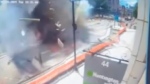 This image made from video provided by Cleveland 19 WOIO-TV shows debris flying through the air after a natural gas explosion caused extensive damage to a building in Youngstown, Ohio, Tuesday, May 28, 2024, and injured people, authorities said. (WOIO-TV via AP)