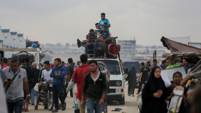 Palestinians fleeing from the southern Gaza city of Rafah during an Israeli ground and air offensive in the city on Tuesday, May 28, 2024. (AP Photo/Jehad Alshrafi)