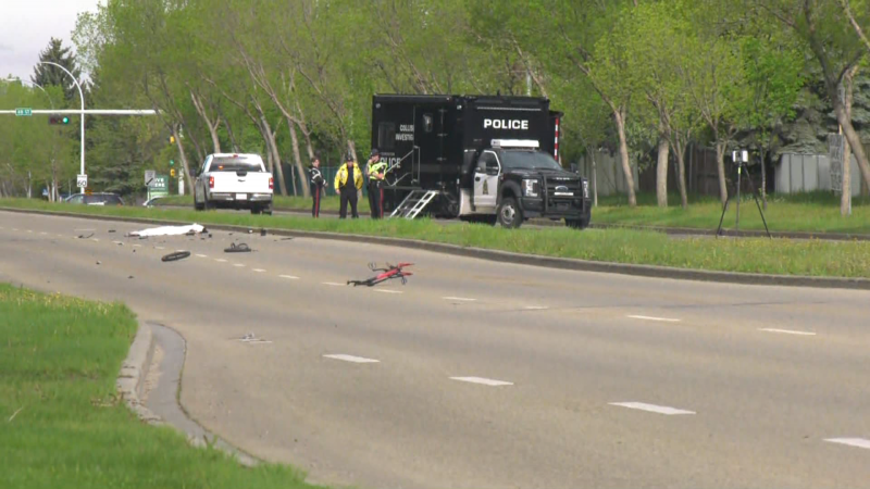 Collision investigators work at the scene where a youth bicyclist was killed in an apparent hit-and-run the morning of May 29, 2024. (Matt Marshall / CTV News Edmonton) 