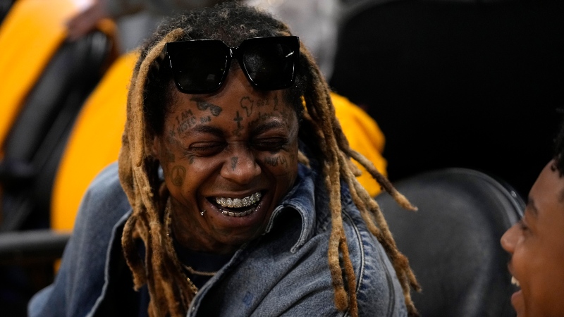 Rapper Lil Wayne is seen prior to an NBA basketball game between the Los Angeles Lakers and the Phoenix Suns Thursday, Oct. 26, 2023, in Los Angeles. (AP Photo/Mark J. Terrill)