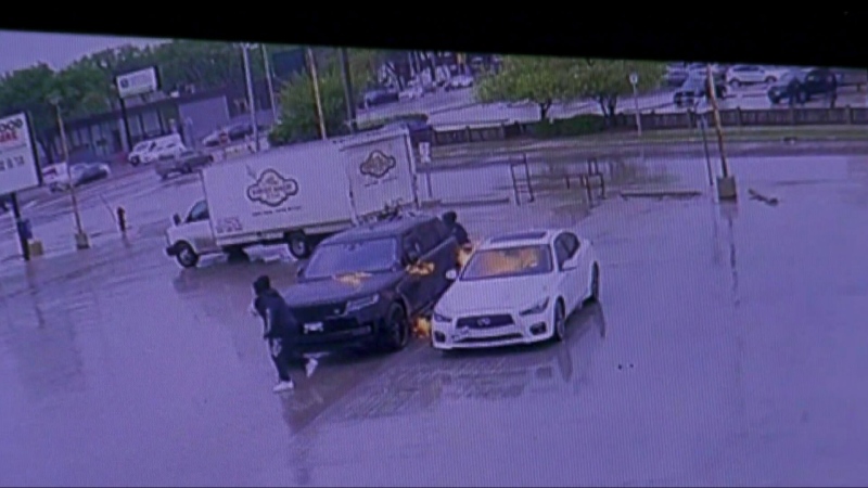 Surveillance footage shows two people appearing to set vehicles on fire in the Foodfare Parking Lot in May 2024. (Alexandra Holyk/CTV News Winnipeg)