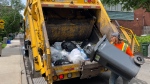A garbage truck picks up residential waste in Centretown Wednesday, May 29, 2024. as council gives rubber stamp to new curbside waste policy going into effect Sept. 30. (Leah Larocque/CTV News Ottawa) 

