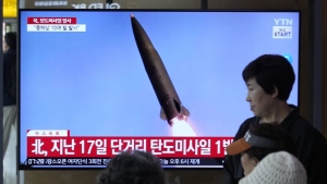 A news program broadcasts a file image of a missile launch by North Korea, at the Seoul Railway Station in Seoul, South Korea, Thursday, May 30, 2024. (Ahn Young-joon/AP Photo)
