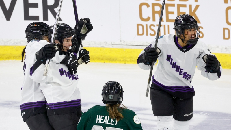 Minnesota forward Liz Schepers, second left, celebrates with teammates Sophie Jaques, left, and Minnesota forward Brittyn Fleming (18) in Game 5 of the PWHL Walter Cup Final. (Mary Schwalm/AP Photo)