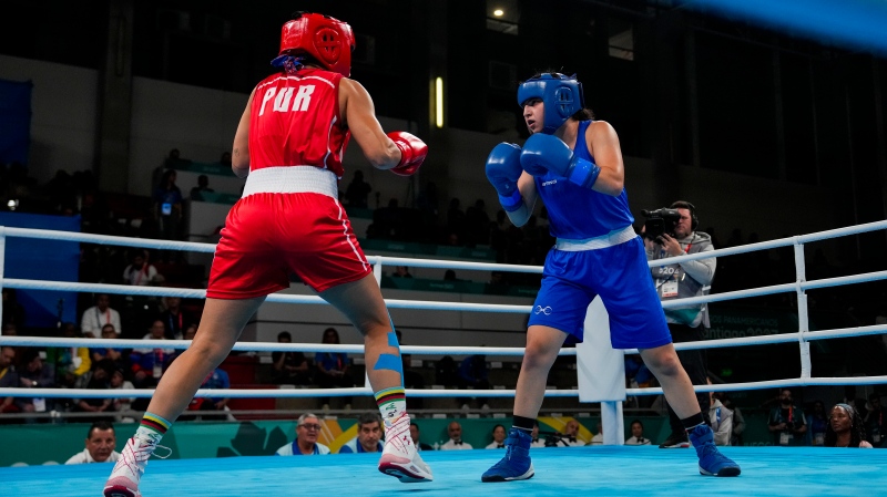 Canadian boxer Marie Al-Ahmadieh battles against Ashleyann Lozada Motta of Puerto Rico during the 2023 Pan American Games, in Santiago, Wednesday, Oct. 25, 2023. THE CANADIAN PRESS/Handout, Leah Hennel, COC