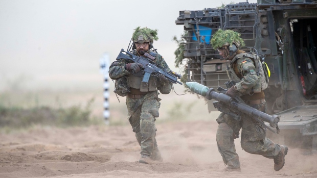 German soldiers take part in 'Grand Quadriga 2024', a wide-scale exercise of the German Bundeswehr that rehearses moving two divisions from the central part of Europe to eastern. (Mindaugas Kulbis/AP)