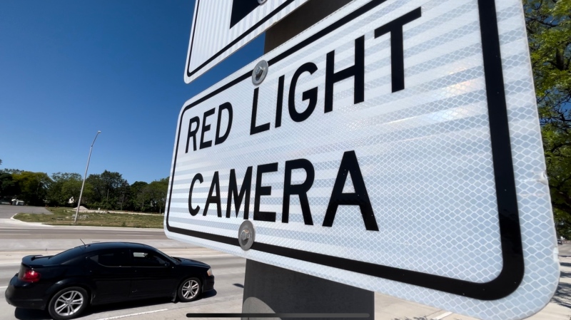 A red light camera warning sign on Huron Church Road in Windsor, Ont. on May 30, 2024. (Rich Garton/CTV Windsor News)