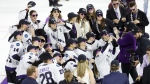 Minnesota defender Dominique Kremer (36) takes a group selfie with her team after defeating Boston to win the PWHL Walter Cup, Wednesday May 29, 2024, in Lowell, Mass. (AP Photo/Mary Schwalm)