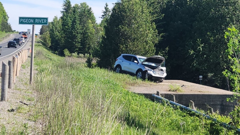 A vehicle crashed through a guardrail on Highway 35, coming to rest on a culvert in Kawartha Lakes, Ont., on Wed., May 29, 2024. (Source: OPP)