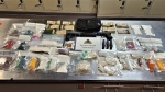 The searches of both the vehicle and the man's residence yielded two guns, 1.25 kilograms of suspected cocaine, 799 grams of suspected fentanyl, 113 grams of suspected methamphetamine and more than 600 suspected prescription pills – all of which were seized, police said. (Kelowna RCMP)