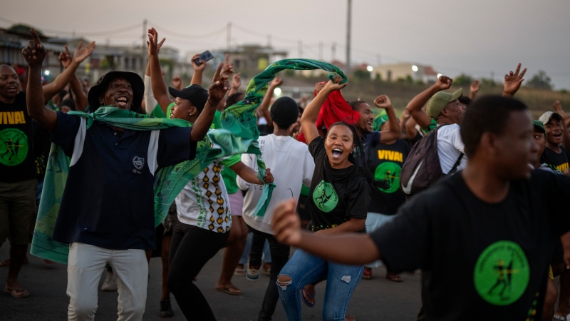 MK Party supporters dance in the middle of the street in Mahlbnathini village in rural KwaZulu-Natal, South Africa, on Thursday May 30, 2024. MK Party is currently leading in the provincial poll against the ANC, who've held the stronghold in the province for the last 20 years. (AP Photo/Emilio Morenatti)