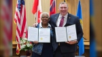 Mayor Alex Nuttall and Saginaw, MI, Mayor Brenda Moore sign sister city contract. May 30, 2024. (Photo: submitted)