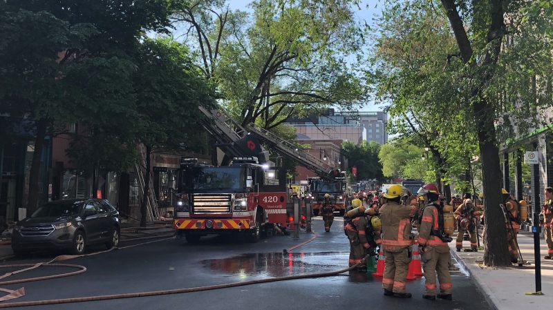 Montreal firefighters are battling a four-alarm blaze that broke out in a three-storey building near the Saint-Laurent Metro. (Scott Prouse/CTV News)