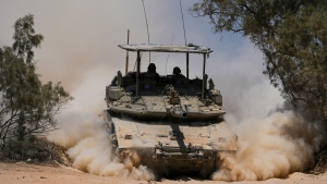 Israeli soldiers drive a tank near the Israeli-Gaza border, in southern Israel, Wednesday, May 29, 2024. (Tsafrir Abayov / AP Photo)