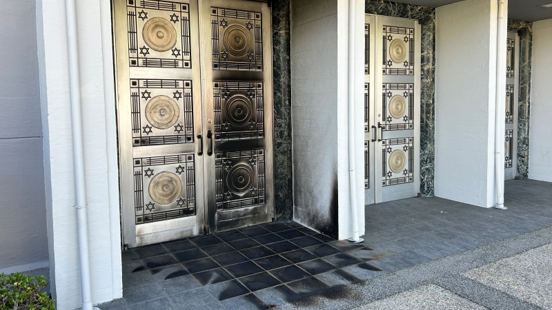 Charred front doors at the Schara Tzedeck synagogue in Vancouver are seen on May 31, 2024. (Jim Fong/CTV News)