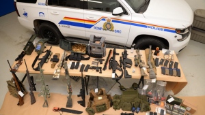 Jury selection is scheduled for two men charged with conspiracy to commit murder at a 2022 border protest at Coutts, Alta. Weapons and ammunition seized by the RCMP are shown in a 2022 handout photo. (THE CANADIAN PRESS/RCMP handout)