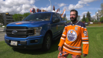 Ben Crockett stands by his Oilers-themed truck to show support for the Edmonton Oilers on May 29, 2024. (Matt Marshall / CTV News Edmonton)