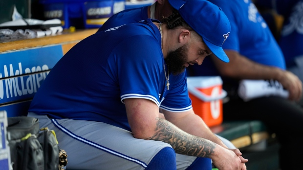 Toronto Blue Jays pitcher Alek Manoah sits on the bench in the fifth inning of a baseball game against the Detroit Tigers, Friday, May 24, 2024, in Detroit. (AP Photo/Paul Sancya) 