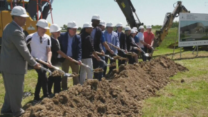 Officials pick up shovelfuls of dirt at the groundbreaking ceremony for Kitchener’s newest multi-purpose indoor recreation facility at RBJ Schlegel Park. (Dave Pettitt/CTV News)