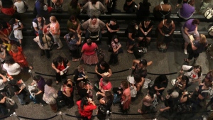 This June 28, 2011, file photo shows people waiting to attend an autograph signing event during the Romance Writers of America Annual Conference in New York. (AP Photo/Tina Fineberg, File)