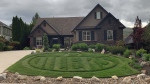 Jeff Krause cuts an Oilers logo into the lawn of his Kelowna home to support the Edmonton Oilers playoff runs. (Credit: Jeff Krause)