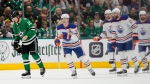 Edmonton Oilers forward Ryan Nugent-Hopkins (93) skates back to the bench past Dallas Stars centre Ty Dellandrea (10) after Nugent-Hopkins scored during the first period of Game 5 of the NHL Western Conference Final on May 31, 2024, in Dallas. (Julio Cortez/Associated Press)