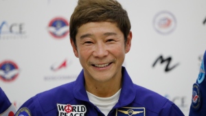Space flight participant Yusaku Maezawa attends a news conference ahead of the expedition to the International Space Station at the Gagarin Cosmonauts' Training Center in Star City outside Moscow, Russia, on Oct. 14, 2021. (Shamil Zhumatov/Pool Photo via AP, File)
