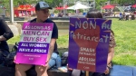 Two supporters take part in the 'World Survivors' March for the Abolition of prostitution and real equality between women and men' in Montreal on June 1, 2024. (Christine Long, CTV News)