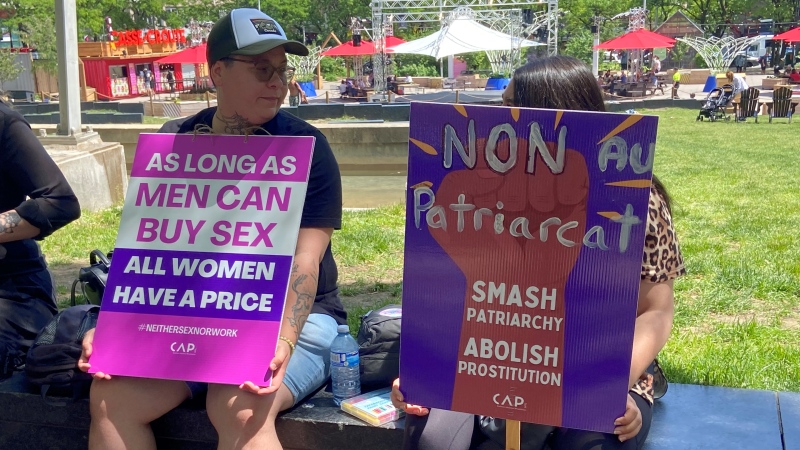 Two supporters take part in the 'World Survivors' March for the Abolition of prostitution and real equality between women and men' in Montreal on June 1, 2024. (Christine Long, CTV News)