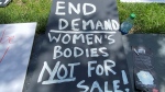A sign use in the 'World Survivors' March for the Abolition of prostitution and real equality between women and men' in Montreal on June 1, 2024. (Christine Long)