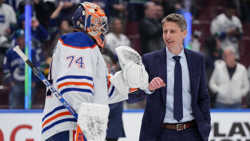Edmonton Oilers head coach Kris Knoblauch and goalie Stuart Skinner after Game 7 in the Stanley Cup second-round playoff series in Vancouver on May 20, 2024. (Darryl Dyck)